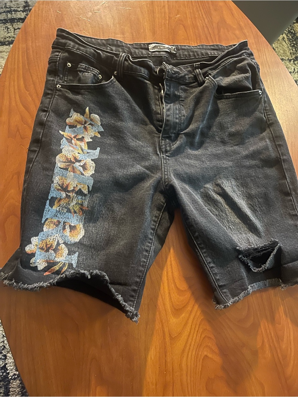 AMIRI Black Distressed Jean Shorts with Floral Side Print